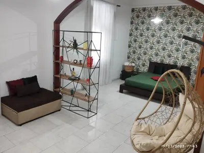 a living room with a couch and a chair at La casa di Nanà in centro in Palermo