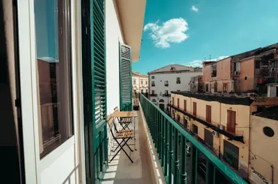 a balcony with a view of a city at Valguarnera Studio Apartments in Palermo