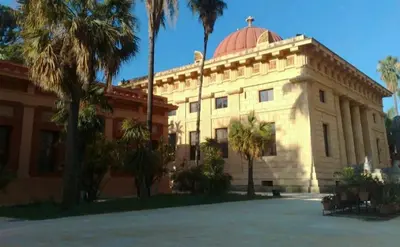 a building with a dome on top of it at Ally's house in Palermo