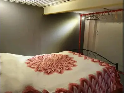 a large cake sitting on top of a bed at Ally's house in Palermo