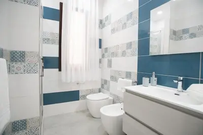 a bathroom with a toilet and a sink at La Chiostrina in Castellammare del Golfo