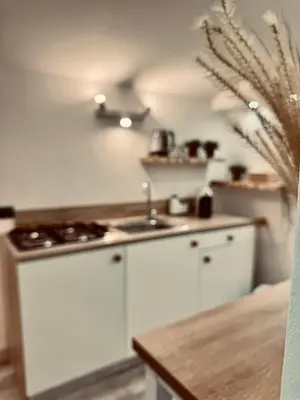 a kitchen with white cabinets and a sink at Centro Storico Palermo Stationsuite N5 WiFi Tutto a Piedi! in Palermo