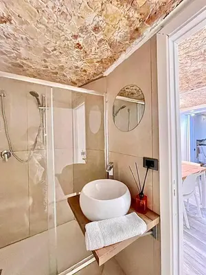 a bathroom with a sink and a shower at Centro Storico Palermo Stationsuite N5 WiFi Tutto a Piedi! in Palermo