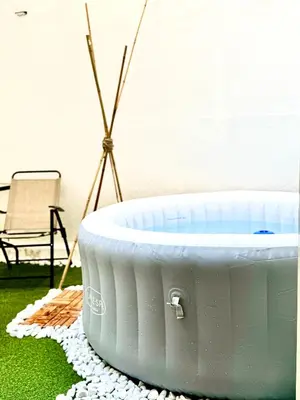 a white bath tub sitting on top of a rug at Centro Storico Palermo Stationsuite N5 WiFi Tutto a Piedi! in Palermo