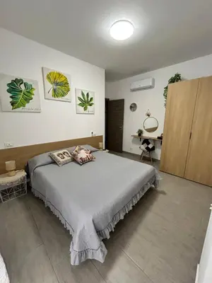 a bedroom with a large bed in a room at PortAzzurra in Carini