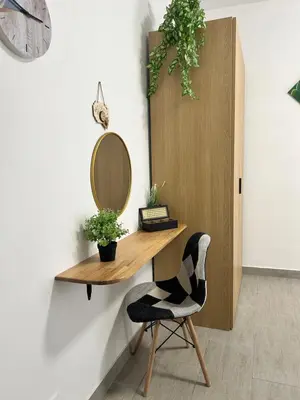 a dressing table with a mirror and a chair at PortAzzurra in Carini