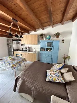 a kitchen with a large bed in a room at PortAzzurra in Carini