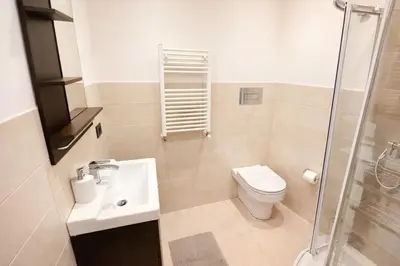 a bathroom with a toilet and a sink and a shower at Giardino Lussemburgo, Elegante e confortevole appartamento tra Mondello e il centro storico di Palermo in Palermo