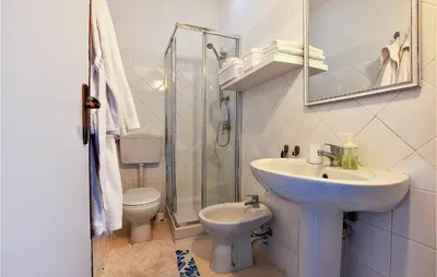 a bathroom with a sink and a toilet and a shower at Amazing Home In Trappeto With Wifi in Trappeto