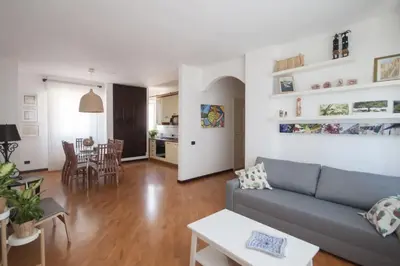 a living room with a couch and a table at Casa Sul Mare Seaside apt in front of the sea in Palermo