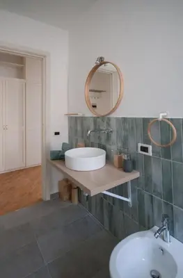 a bathroom with a sink and a mirror at Casa Sul Mare Seaside apt in front of the sea in Palermo