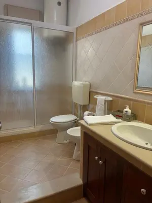 a bathroom with a toilet and a sink at Casa Vacanze Gloria in Balestrate