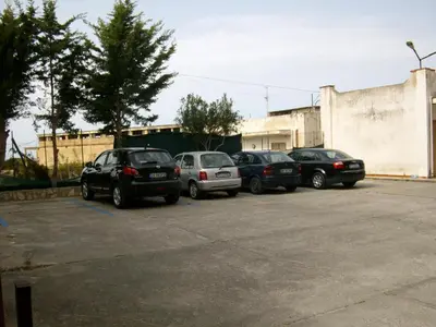 a row of cars parked in a parking lot at Casa Vacanze Gloria in Balestrate