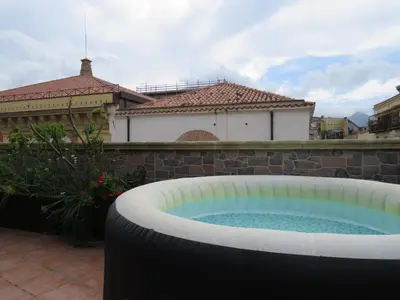 a hot tub in the backyard of a house at Awesome terrace and apartment in the city centre in Palermo