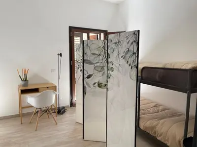 a bedroom with a bed and a glass closet at Casa Giura in Palermo