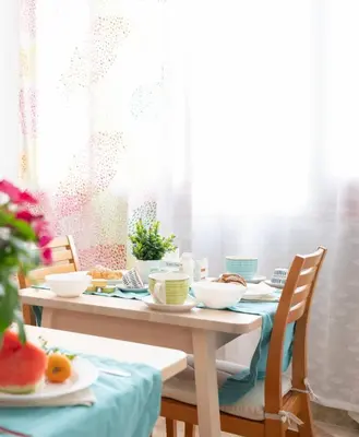 a table with plates and bowls of fruit on it at Posidonia B&B in Terrasini
