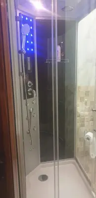 a shower with a glass door in a bathroom at Casa vacanze Il Girasole in Bagheria