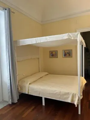 a bedroom with two bunk beds in a room at La casa del Maestro in Palermo