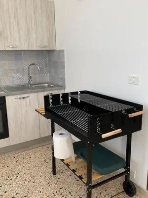 a black table in a kitchen with a sink at Il Rifugio della Grotta S.Ninfa in Santa Ninfa
