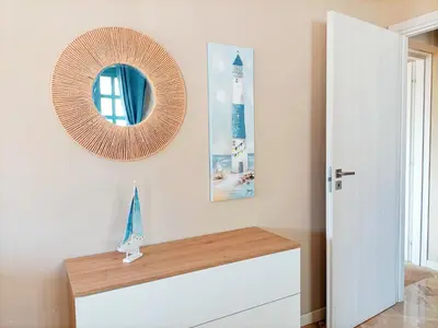 a room with a mirror on the wall and a dresser at Villemar in Isola delle Femmine