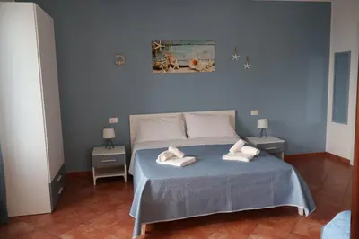 a bedroom with a bed with two towels on it at Verdemare in Macari