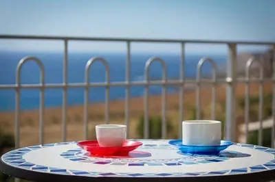 two cups sitting on a plate on a table at Verdemare in Macari