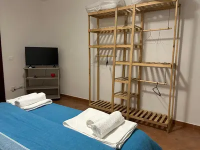 a bedroom with a bunk bed and a television at DM house in Palermo