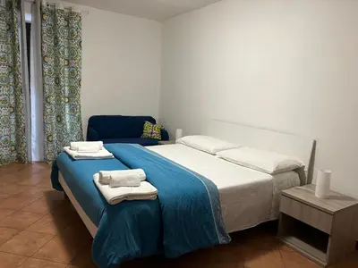 a bedroom with a bed with towels on it at DM house in Palermo