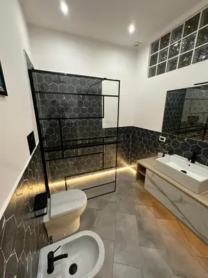 a bathroom with a toilet and a sink at Palermo Wow - Aragona in Palermo