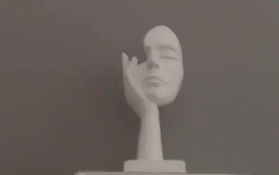 a white statuette of a woman with her hand on her face at Historic Centre - Apartment at Foro Borbonico in Palermo