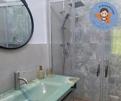 a bathroom with a shower with a sink and a mirror at A'nicaredda (la piccolina) in Castellammare del Golfo