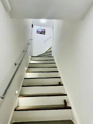 a staircase leading up to the second floor of a house at Corleone Home in Corleone