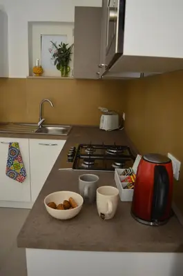 a kitchen counter with a coffee maker and a bowl of food at Futtitinni Home casamia in Palermo