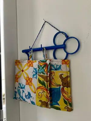 a pair of scissors hanging on a wall at A casa di Alex in Palermo