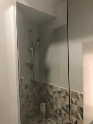 a shower with a glass door in a bathroom at City Center Apartment da FeLù in Palermo