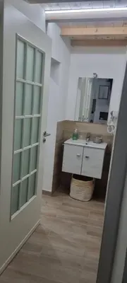 a bathroom with a sink and a mirror at Il quaRtetto apartment in Palermo