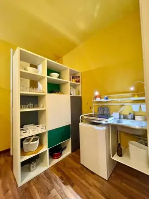 a yellow kitchen with a sink and a counter at MATTI X 2 in Palermo