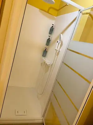 a shower in a bathroom with a glass wall at MATTI X 2 in Palermo