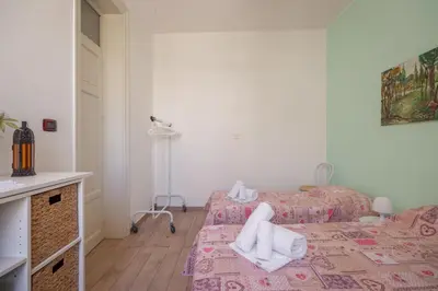 a room with a bed with towels on it at Casa Ferrito - Porticello in Porticello