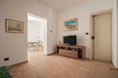 a living room with a flat screen tv on a table at Casa Ferrito - Porticello in Porticello