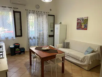 a living room with a couch and a table at A casa ru zu Nino in Capaci