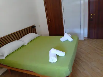 two rolls of toilet paper sitting on top of a bed at Antadia in Palermo