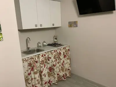 a kitchen with a sink with a curtain on it at Demma' s DIAMOND in Palermo