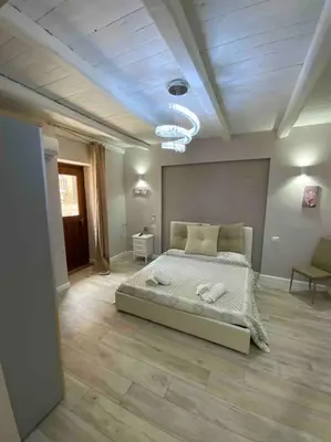 a bedroom with a large bed in a room at Spasimo Boutique in Palermo