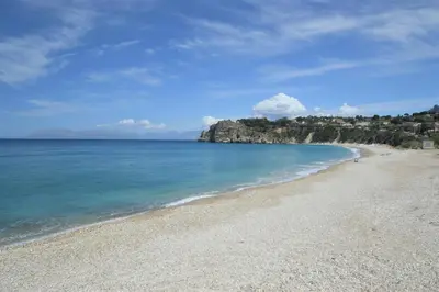 a view of a beach with the blue water at Appartamenti Amagea in Scopello