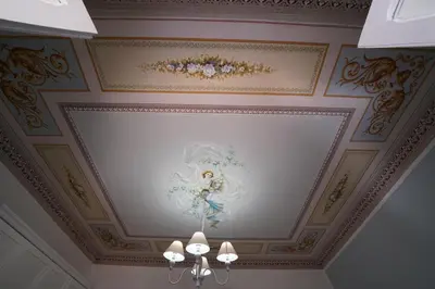 a ceiling with a painting of an angel on it at Regina Stella in Lascari