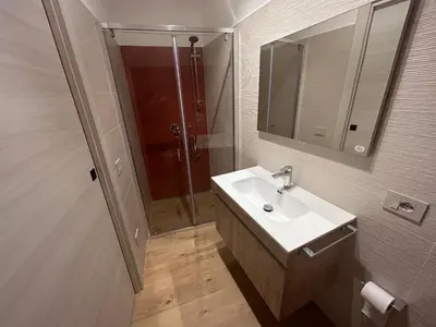 a bathroom with a sink and a shower at La Nicaredda in Alcamo