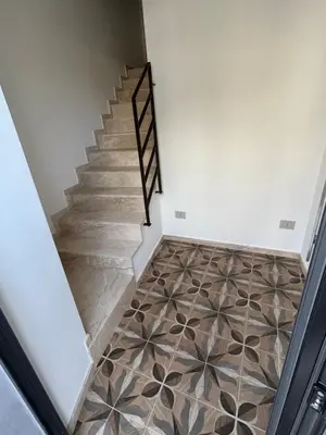 a staircase with a tile floor in a house at La Nicaredda in Alcamo