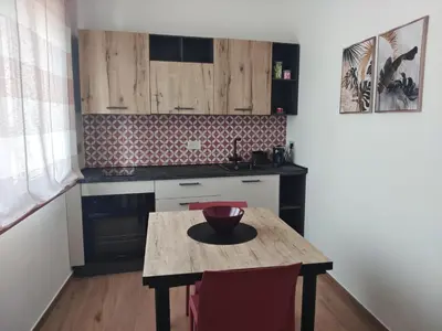 a kitchen with a wooden table with a bowl on it at La Nicaredda in Alcamo
