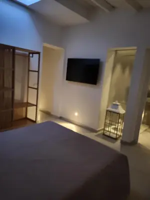 a bedroom with a bed and a view of a balcony at Malaspina Cico Suite in Palermo